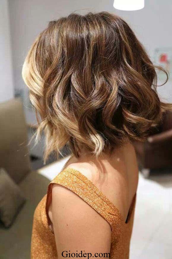 10 Chin-Length Curly Bob with Short Bangs for 2024 3